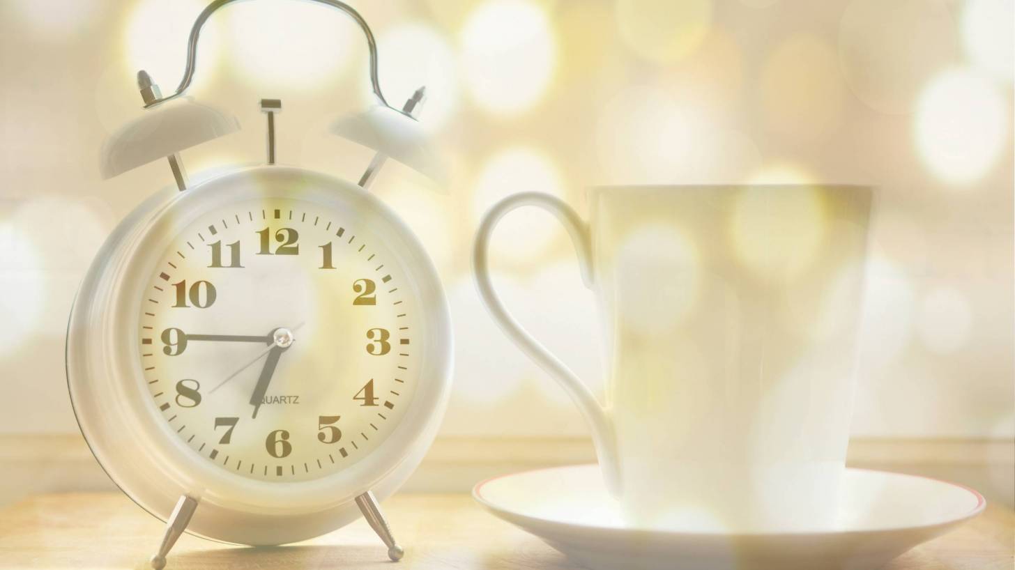 alarm clock and cup of coffee
