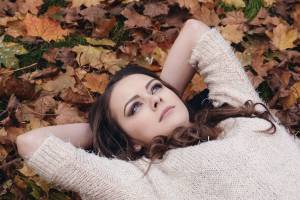 girl laying on her back looking at the sky