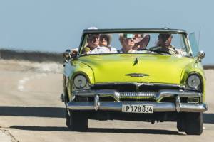 older friends in convertable car