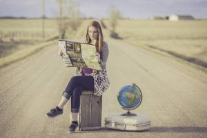woman traveler looking at a map