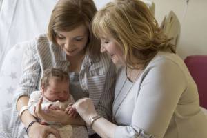 new born, mom and grandma