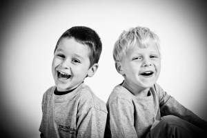 two happy boys , they have all their shots to be healthy