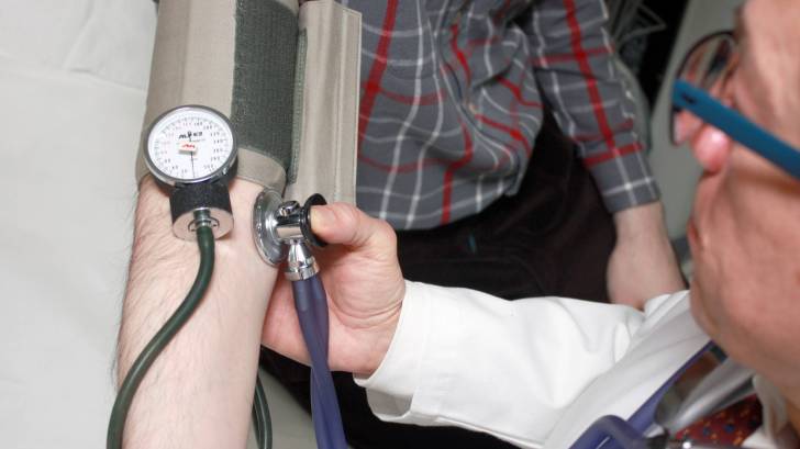doctor taking vitals of a patient