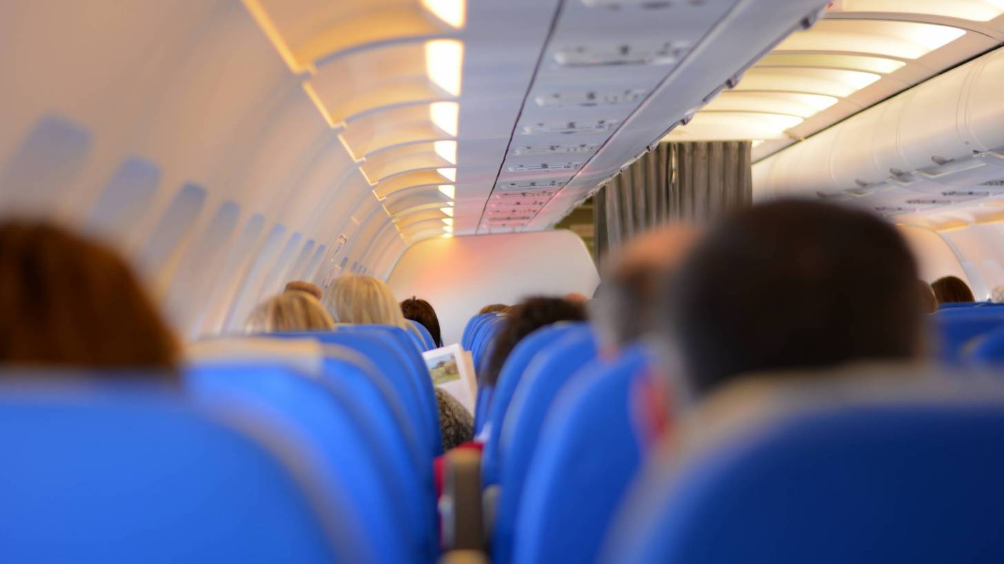 passengers on a plane departing
