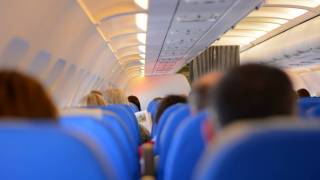 passengers on a plane departing