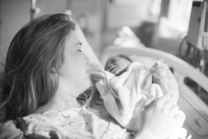 mom just delivered a healthy baby in a hospital bed