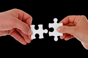 putting two pieces of a puzzle together